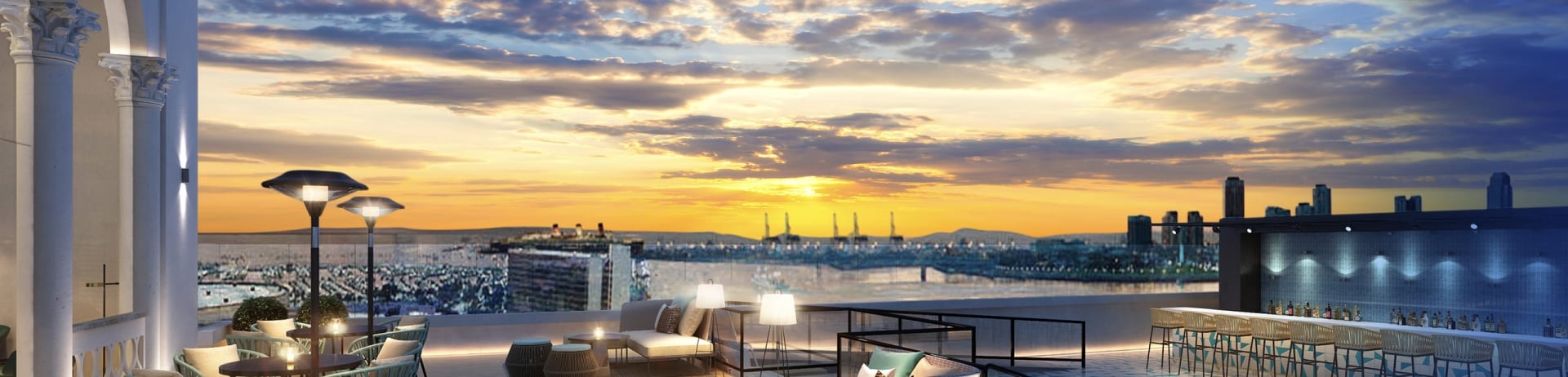 The rooftop seating area and bar at Halo Terrace at dusk at Fairmont Breakers in Long Beach, CA.